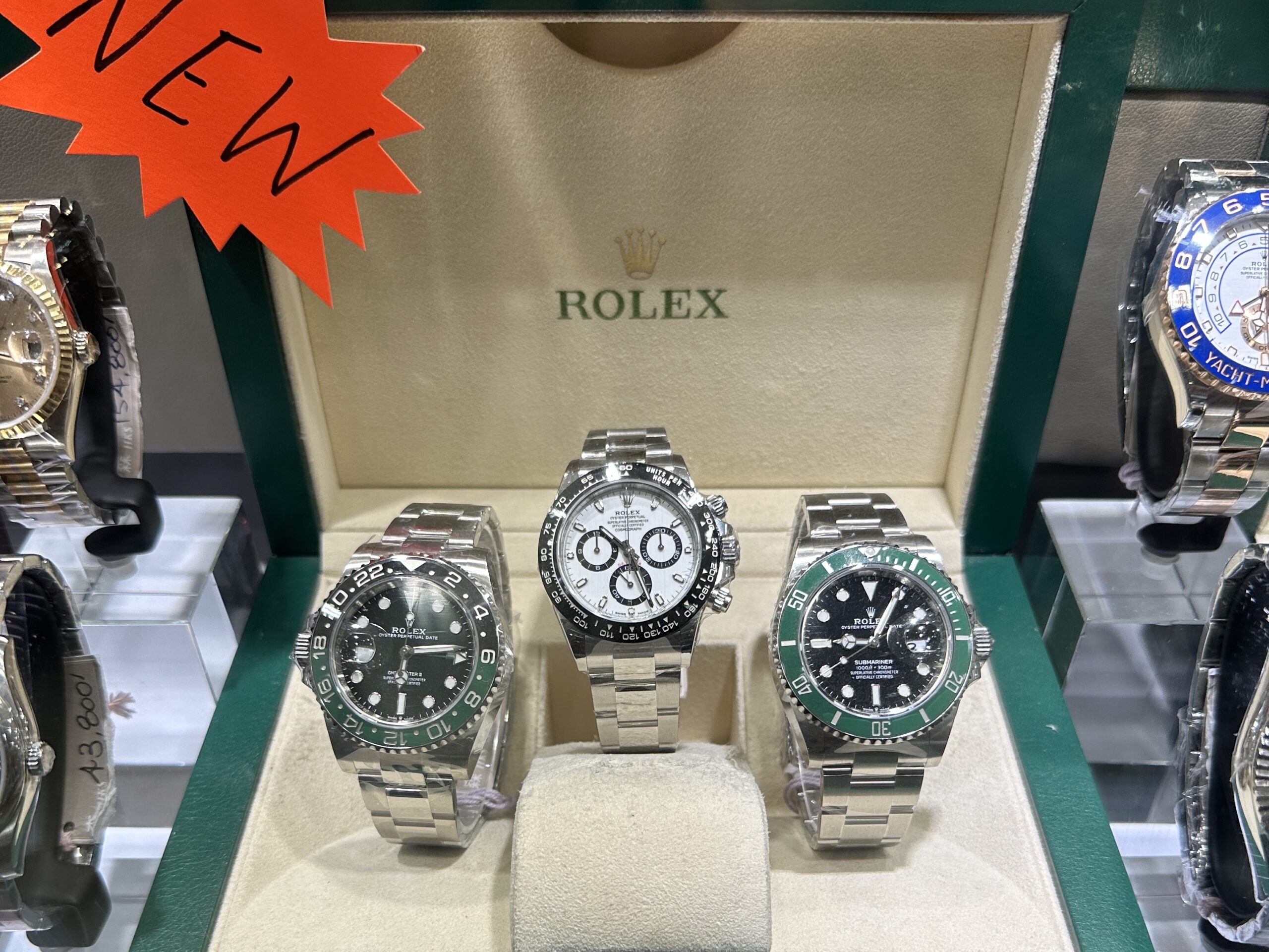 Rolex GMT Master II, Rolex Daytona and Rolex Submariner in great market watch shop window